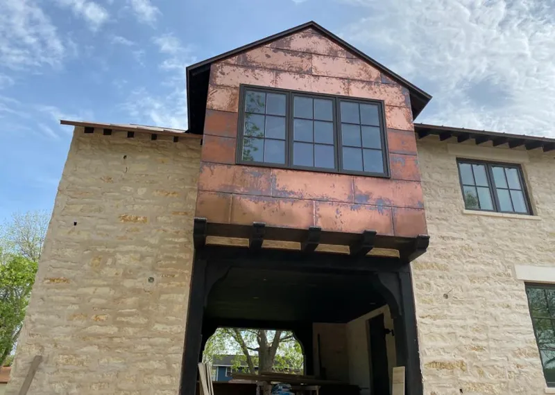 Copper metal panel facade on a stone building for Metal Roof Coating in Spring Valley