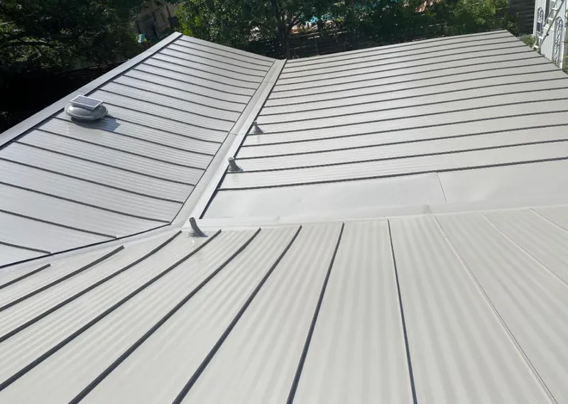 Solar attic fan installed on a metal roof for Roof Ventilation in Spring Valley